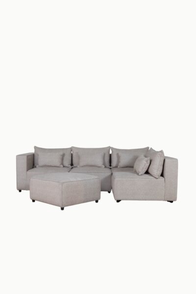 Canapé d'angle modulable en tissu chenille beige, composé de plusieurs modules avec coussins assortis"