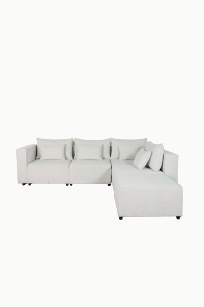 Canapé d'angle modulable en tissu chenille écru, composé de plusieurs modules avec coussins assortis"