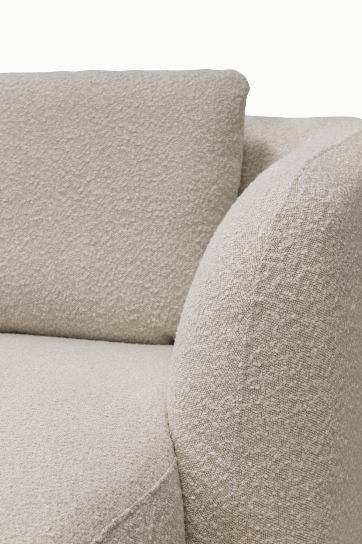 Canapé d’angle marina en laine bouclée écru, forme arrondie et assise confortable