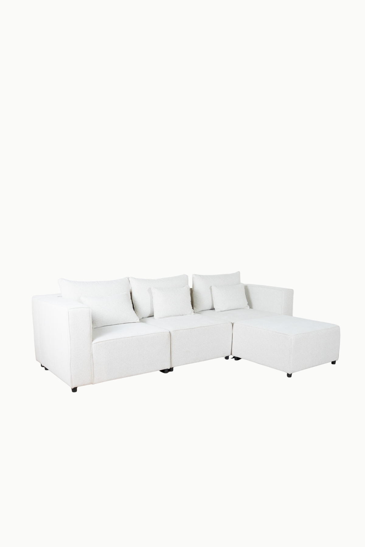 canapé_modulable_monte_carlo_tissus_chenille_écru (3) Canapé modulable en tissu chenille écru, composé de plusieurs modules avec coussins assortis"