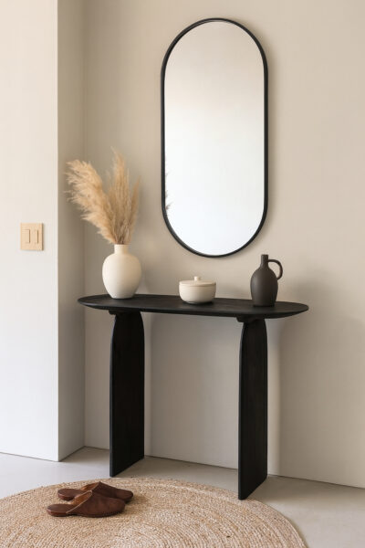 Console Emilia en bois d’acacia noir, design moderne avec plateau ovale et pieds en forme d'arche